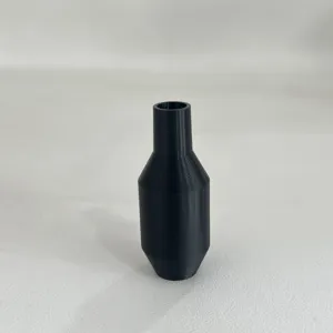Close-up detail of black plastic siphon hose shaker valve connector accessory part.