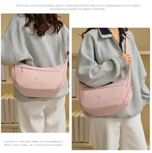 Casual pink canvas crossbody bag, large capacity crescent shoulder bag for women daily use.
