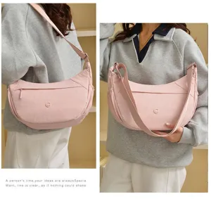 Japanese casual large capacity pink nylon dumpling shoulder bag for women daily use.
