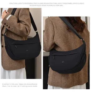 Detailed view of the casual black nylon crossbody bag, showing its large capacity and design.