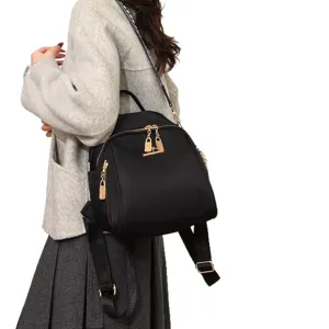 Zwarte oxford stoffen schelp rugzak voor dames, stijlvolle multifunctionele reistas.