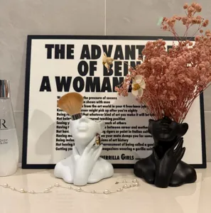 Detail view of Nordic ceramic human face vase and pen holder set, chic desktop decor.