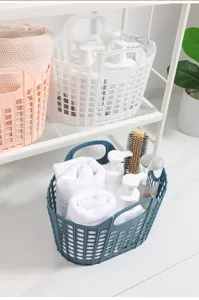 Panier a linge pliable en plastique avec poignees, bac de rangement pour salle de bain.