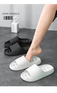 Close-up of non-slip quick-drying bathroom slippers with drainage holes and thick sole.