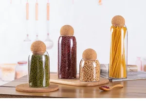 Glass sealed storage jars with cork ball lid for coffee beans, tea, and dry grains detail.