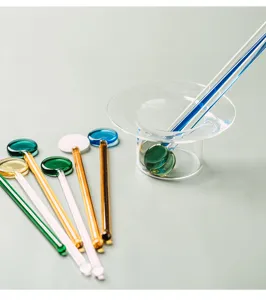 Detailed view of heat-resistant glass stirring rod with long handle for coffee, juice and desserts.