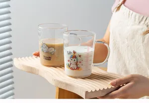 Clear glass milk cup with cute unicorn print and precise scale lines for daily home use.
