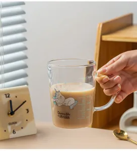 Clear glass measuring milk cup with cute unicorn pattern, heat resistant design for daily use.