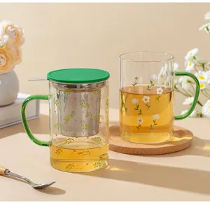 Glass tea cup with infuser, cute floral pattern and green lid, heat resistant for office.