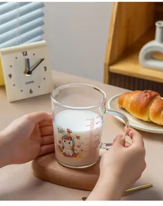 Clear glass measuring cup with cute unicorn cartoon print, heat resistant scale milk mug for home.