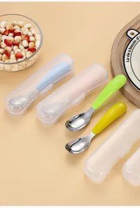 Detailed view of stainless steel baby spoon with cute colorful handles and portable cases.
