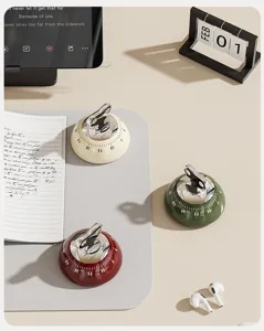 Magnetic mechanical kitchen timer detail view, cute fruit design baking timer for home desk.