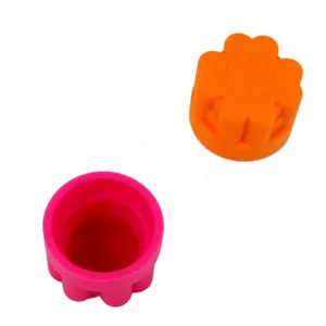 Silicone bottle opener detail showing flower shape and vibrant pink orange colors clearly.