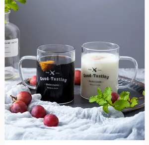 Detailed shot of heat-resistant glass mug with handle for juice, coffee, and tea drinks.
