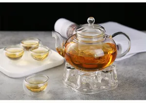 Théière en verre résistante à la chaleur avec filtre et base chauffante pour thé