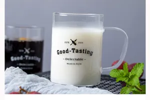 Clear glass coffee mug with handle heat resistant thick design minimalist detail view.