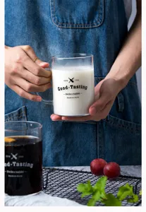 Detailed shot of clear glass mug with handle and stylish text print, perfect for daily drinks.