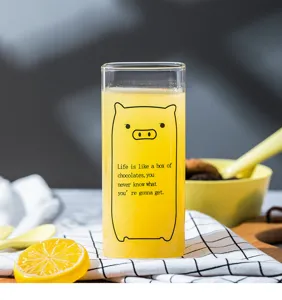 Clear glass square cup detail showing cute pig print and quote design for home daily breakfast.