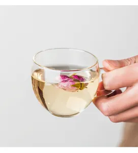 Clear heat resistant borosilicate glass tea cup with handle for office and home use.
