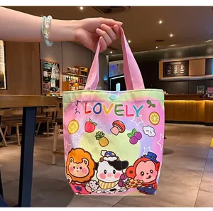 Detail view of a cute hand-drawn cartoon canvas tote bag with colorful design for daily use.