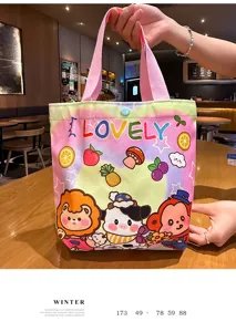 Detail view of cute cartoon canvas tote bag with pink handles and lovely animal illustrations.