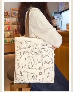 Casual canvas tote bag for women, large shoulder bag with cute cat print for daily commute.