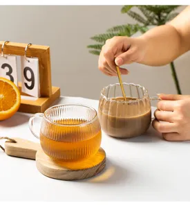 Japanese style ribbed glass coffee cup and clear pumpkin water cup for daily tea use.