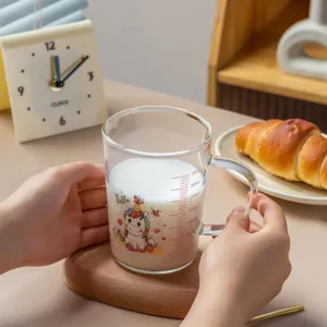 Glass milk cup with scale, cute cartoon design, high borosilicate heat-resistant main view.