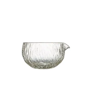 Clear glass matcha bowl with hammered texture and spout ideal for traditional tea ceremony.