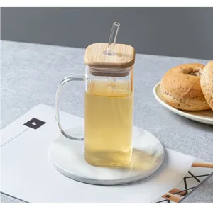 Square glass mug with wooden lid and straw, transparent heat-resistant drinkware for daily use.