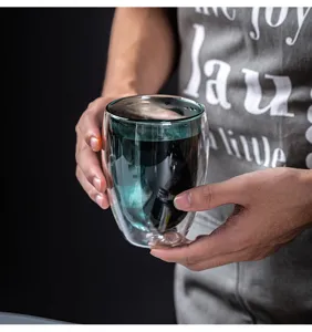 Close-up view of clear double wall insulated glass cup for hot coffee and tea daily use.