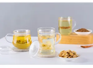 Borosilicate glass tea cup with infuser and lid, minimalist design for office and home use.