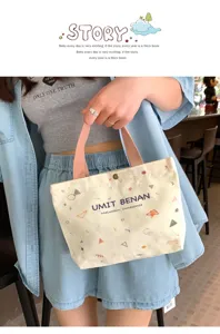 Small canvas tote bag with geometric print and pink handles, detailed view for daily use.