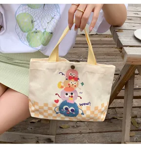 Cute monster print canvas tote bag, casual versatile handbag for daily shopping and outing.