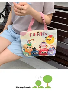 Detailed view of cute monster printed canvas tote bag, casual style for daily use.