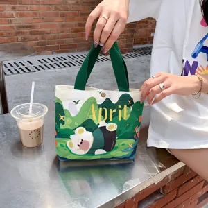 Cute small canvas tote bag for women, portable lunch box bag and daily commuting handbag.