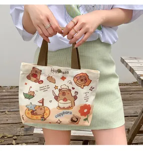 Cute cartoon capybara print canvas tote bag for women, casual large capacity shoulder bag.