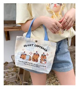 Cute cartoon capybara print canvas handbag casual small tote bag for women daily shopping.