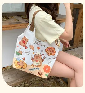 Cute cartoon capybara canvas tote bag for women, large capacity daily shoulder casual bag.