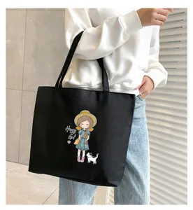 Casual black canvas tote bag with cute cartoon girl print, large capacity commuter bag.