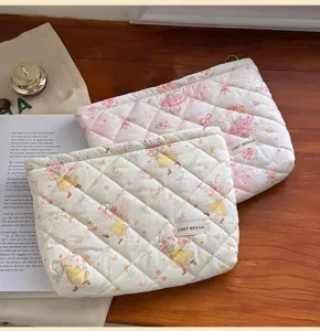 Quilted cosmetic bag with cute cartoon girl print, large capacity zippered makeup pouch.