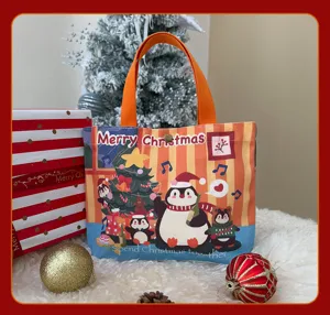 Sac cabas en toile de Noël avec joli design de pingouin de dessin animé, parfait.