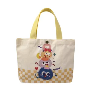Cute cartoon monster canvas tote bag for women, large capacity casual aesthetic shopping bag.