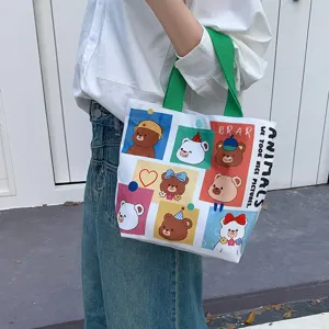 Cute cartoon bear canvas tote bag for women, casual daily commuter handbag with top handle.