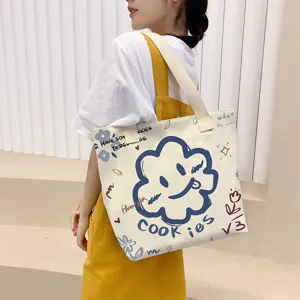 Large capacity canvas tote bag for women, Korean style ins student shoulder handbag with print.