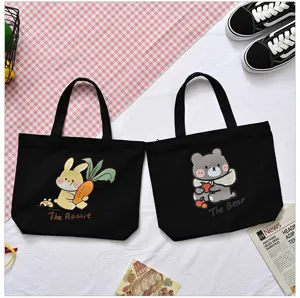 Cute black canvas tote bag for women, casual lunch bag with cartoon animal print.