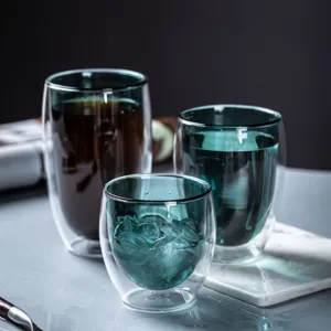 Double wall insulated glass coffee mugs set, clear teal tea cups for home and office use.