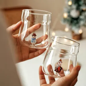 Cute Christmas glass cup with 3D snowman and Santa Claus design, perfect for coffee and milk.