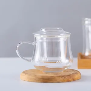 Clear glass tea cup with infuser and lid, heat-resistant glass mug for office and home use.