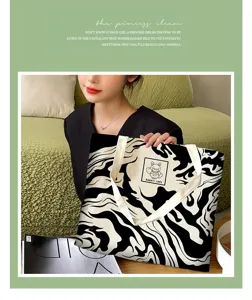 Large capacity black and white abstract canvas tote bag, casual shoulder book bag for daily use.